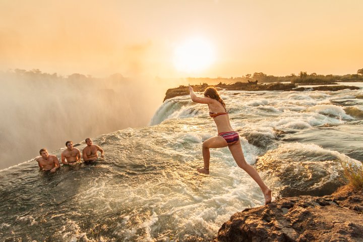 Reasons to enjoy a Zambia safari - swimming in Devils Pool at Victoria Falls