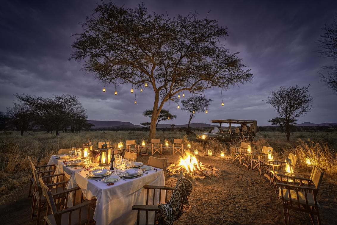 Nimali Central Serengeti dining by the fire